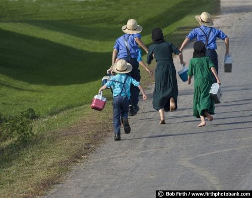 Amish children,walking home from school, WI, Wisconsin, agricultural scene, agriculture, barefoot, bare feet, country, road, boys, girls, playful,lunch pail