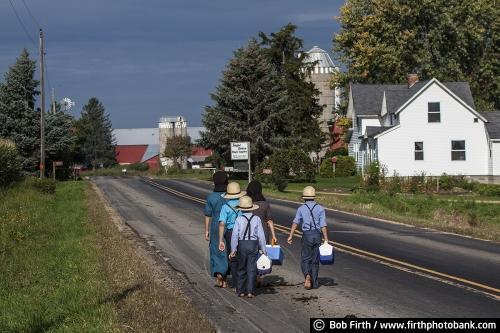 Amish children, walking to school, barefoot, lunch pail, road, Wisconsin,WI, country,farm,barn,fall,agricultural scene, agriculture;Amish home; Amish homestead, Amish house,boy,girl,bare feet,lunch pail