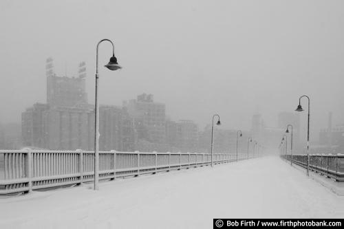 black and white photo;Minneapolis;JJ Hill Bridge;Minneapolis skyline;Minnesota;MN;Mpls;snow covered bridge;walking bridge;pedestrian bridge;lamp posts;fog;foggy;foot bridge;peaceful;snow;winter;solitude;walkway;snow storm;snowy