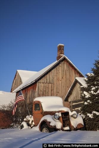 automobile;Cars and Trucks;classic cars;collectible;Collector Truck;rural;old trucks in snow;snow covered trucks;snow covered vintage automobiles;rust;patina;rusty;rusty truck;moldering truck;weathered truck;snow covered truck;vehicle;old pickup truck;vintage;vintage pickup truck;MN;Minnesota;country;American flag;barn;farm