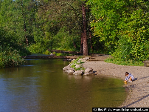 Mississippi River;boy;child;destination;explore;Headwaters;Great River Road;Itasca State Park;kid;Mighty Mississippi;Minnesota;quiet water;rocks;shoreline;summer;tourism;tourist;trees;up north;upper Mississippi River;northern Minnesota