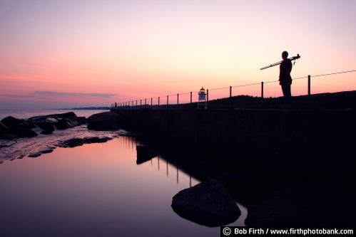 twilight;sunsets;silhouettes;pink;pier;photographer;photo;person contemplating;northern Minnesota;North Shore Scenic Drive;North Shore;moody;Minnesotas North Shore;Minnesota;lighthouse;Lake Superior;Grand Marais Lighthouse;Grand Marais;docks;biggest fresh water lake
