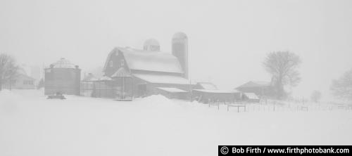 panoramic photo;Winter;Minnesota;MN;cold weather;panoramic;snow;snow storm;country;rural;farm;barn;farm buildings;silo;Carver County