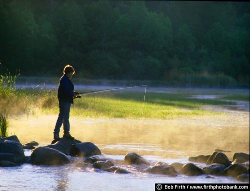 Minnesota;Minnesota State Parks;Itasca State Park;fishing;boy fishing;boy;Mississippi River Headwaters;misty;dawn;sunrises;fishing from rocks;summer;MN