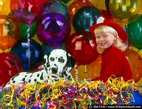 boy;Dalmation;dog;celebration;animal;balloons;black spots;child;companion;companionship;confetti;firemans hat;friends;friendship;fun;adorable;pet;purebred;portrait