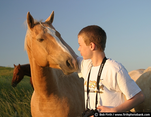 teen;teenager;horse;friends;friendship;boy;camera;child;companion;companionship;farm animal;male;SD;South Dakota;summer