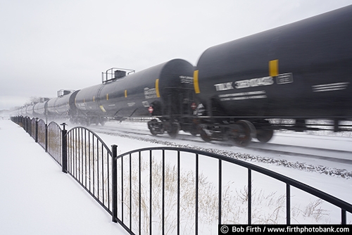 Railroad;industry;Wisconsin;winter;WI;transportation;trains;train cars;train;snow on train tracks;snowy tracks;snowy;snow;shipping;railroad tracks;rail cars;train tracks;tracks;train in motion;motion;Mississippi River town;tanks;tanker;oil cars;railcars