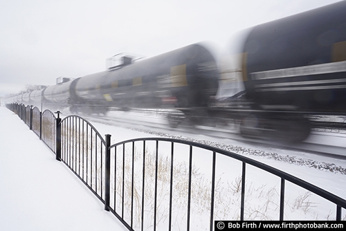 Railroad;industry;Wisconsin;winter;WI;transportation;trains;train cars;train;snow on train tracks;snowy tracks;snowy;snow;shipping;railroad tracks;rail cars;train tracks;tracks;train in motion;motion;Mississippi River town;tanks;tanker;oil cars;railcars