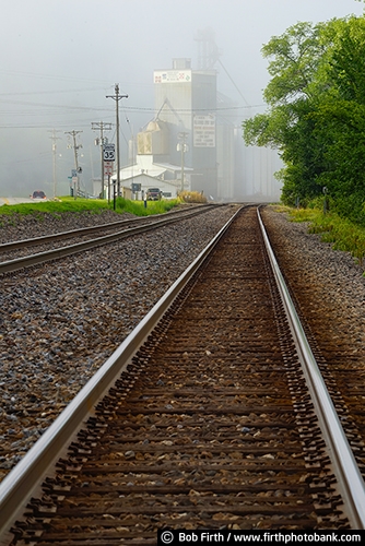 Railroad;tracks;railroad tracks;Alma WI;grain elevator;industry;Mississippi River town;fog;foggy;small town;summer;WI;Wisconsin