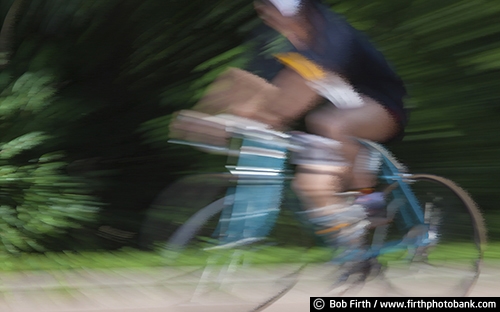 exercise;Bicycling;action shot;bicycle;bike;biker;biking;blur;close up;cycling;cyclist;fast;motion;pedaling;road bike;racing;race;road race;sport;wind effect