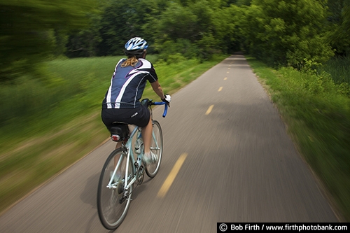 Bicycling;bike;biker;biking;blur;Carver County MN;cycling;cyclist;explore;Minnesota;MN;peaceful;recreation;recreational;road bike;solitude;solo;sport;summer;trail;paved trail;transportation;woman;exercise;motion;Carver Park Reserve;Three Rivers Park District;Victoria MN