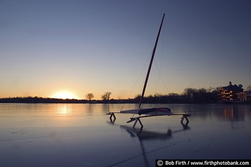 ice boating;ice boat;ice sailing;MN;Minnesota;winter sports;recreation;outdoors;outside;Lake Minnetonka;frozen lake;sail;fun pastime;sunset;silhouette