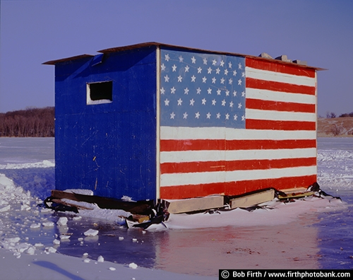 ice house;ice fishing;American flag ;Carver County;fun pastime;Minnesota;outdoors;outside;patriotic;recreation;winter sports;Steiger Lake;Victoria MN