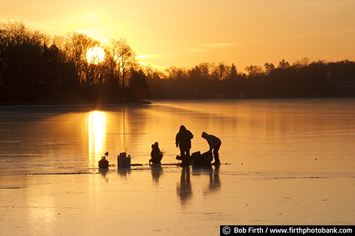 ice fishing;family activity;frozen lake;fun pastime;Minnesota;MN;outdoors;outside;peaceful;recreation;sun;sunset;winter sports;silhouette