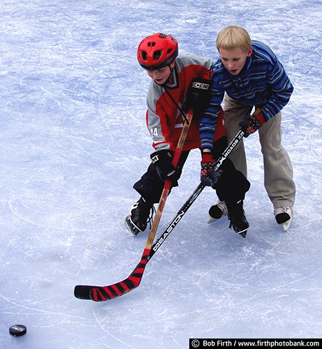 hockey;active;boys;children;competition;competitive;exercise;fun pastime;hockey sticks;friendship;ice skating;ice skater;kids;puck;recreation;winter sports;outdoors;outside