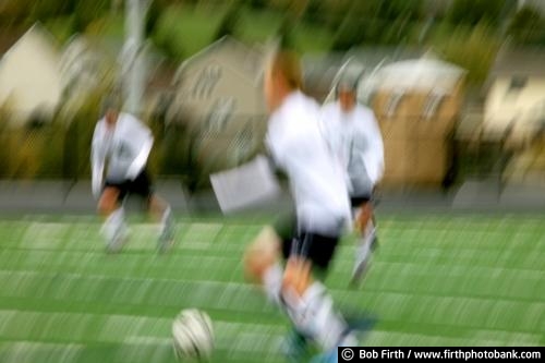 Soccer;futbol;team sport;Sports;athletic;athletes;competitive;competition;competitive sport;contact sport;endurance;exercise;abstract;physical activity;game;boys;male;teenagers;teens;young men;sport;players;motion;action;blur;soccer ball;running;kicking the ball;agressive;break away